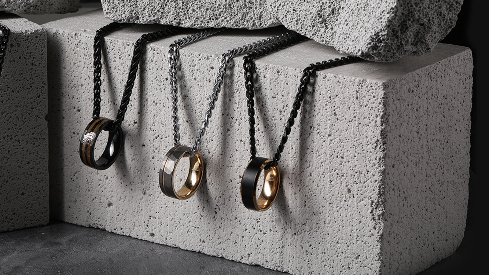 Three men's rings on the necklace