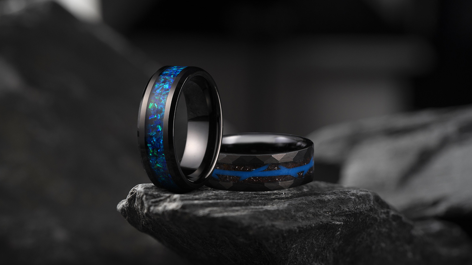 Two black meteorite rings with blue inlay in the middle