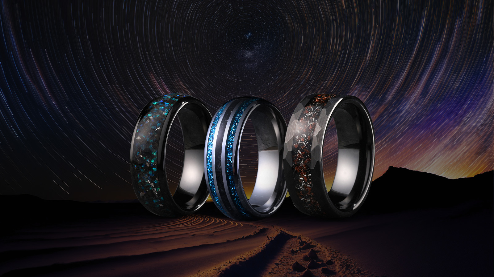 Three meteorite rings, with a blue meteorite ring in the middle and two black meteorite rings next to it