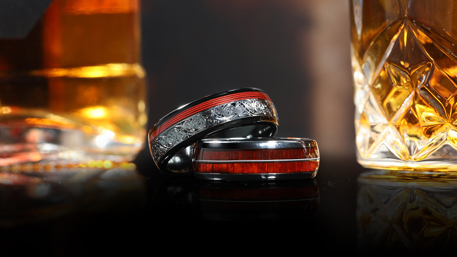 Two silver rings with red inlay in the middle