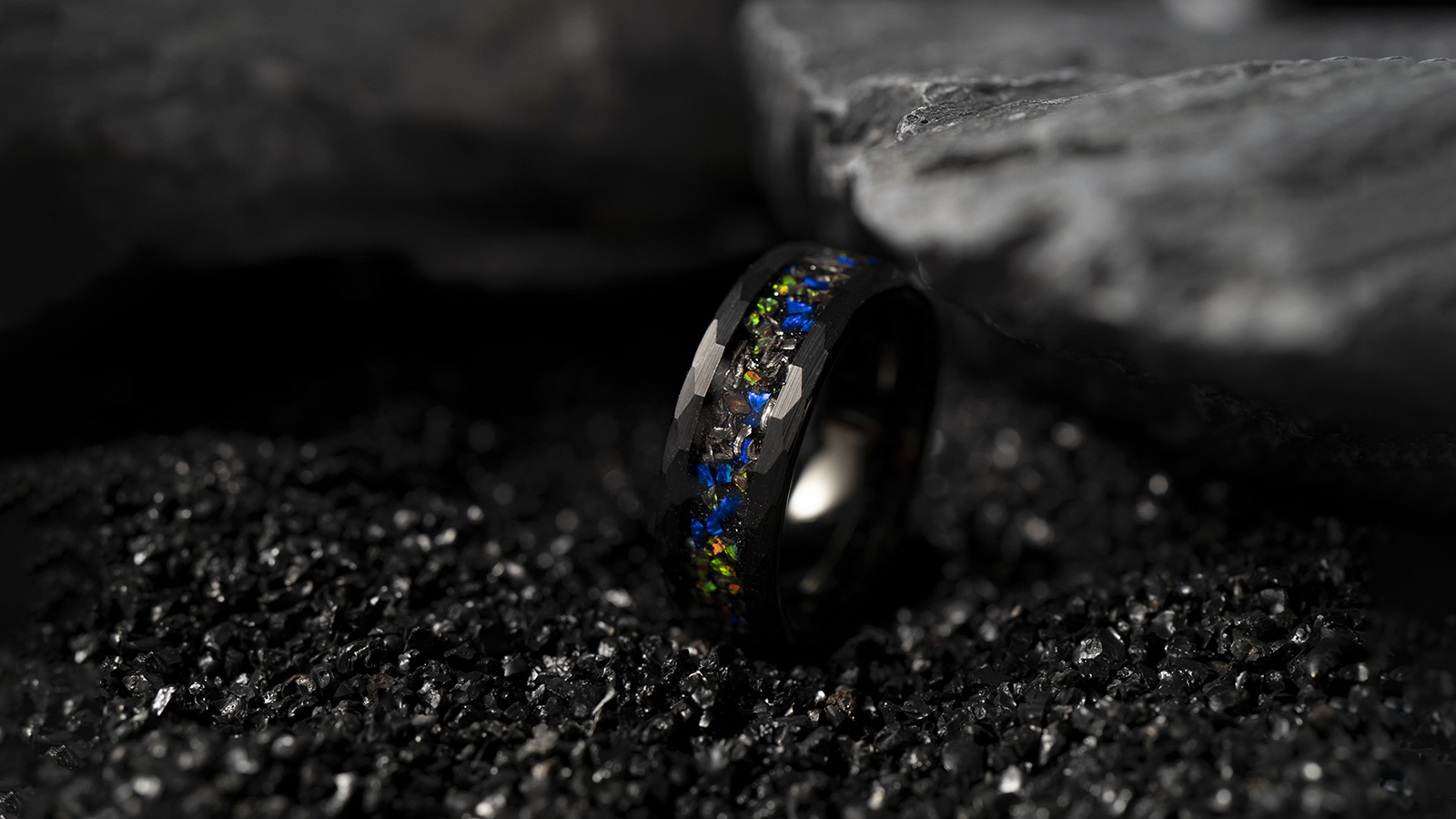 Black men's ring with a stylish and mysterious blue setting